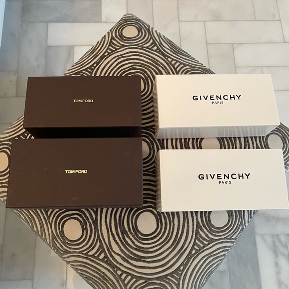 Four Designer sunglass boxes